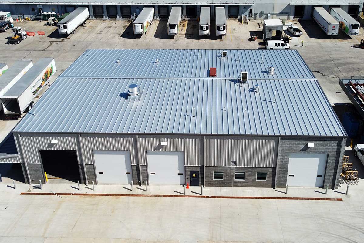 This 10,000-square-foot mechnics shop is a gable building and includes four roll up doors. 