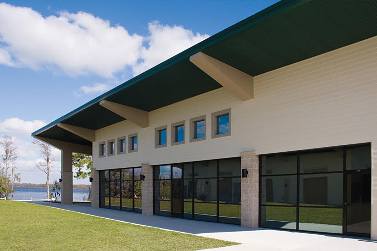 University of Central Florida's 18,000-sq-ft metal building rowing center for women has glass walls facing Lake Picket. 