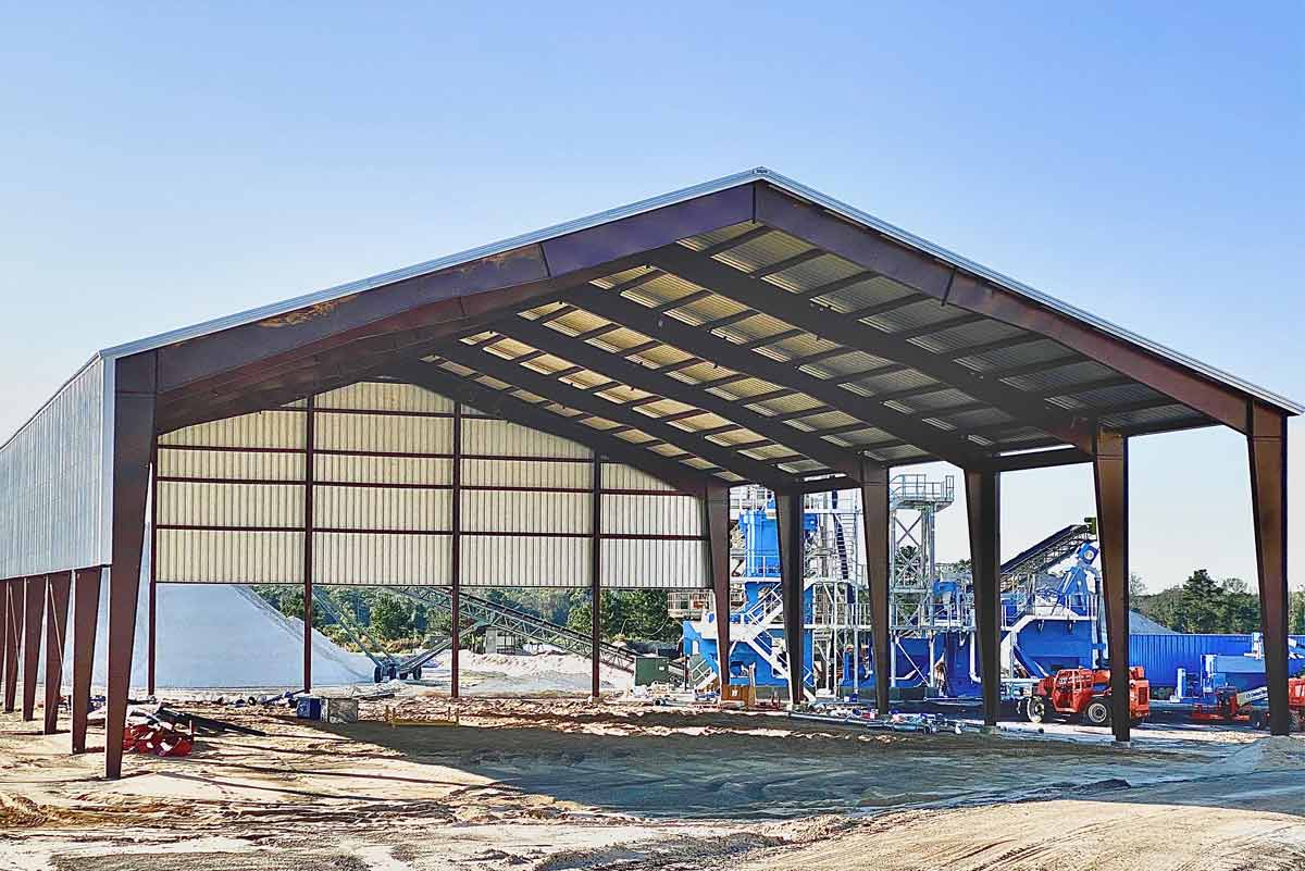 This clear span rigid frame metal building accommodates a sand processing operation. 