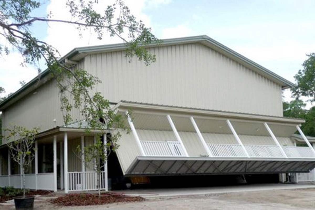 At Danville Hangar, the metal building’s hydraulic front door lifts to reveal an entertaining and airplane storage area. At Danville Hangar, the metal building’s hydraulic front door lifts to reveal an entertaining and airplane storage area.