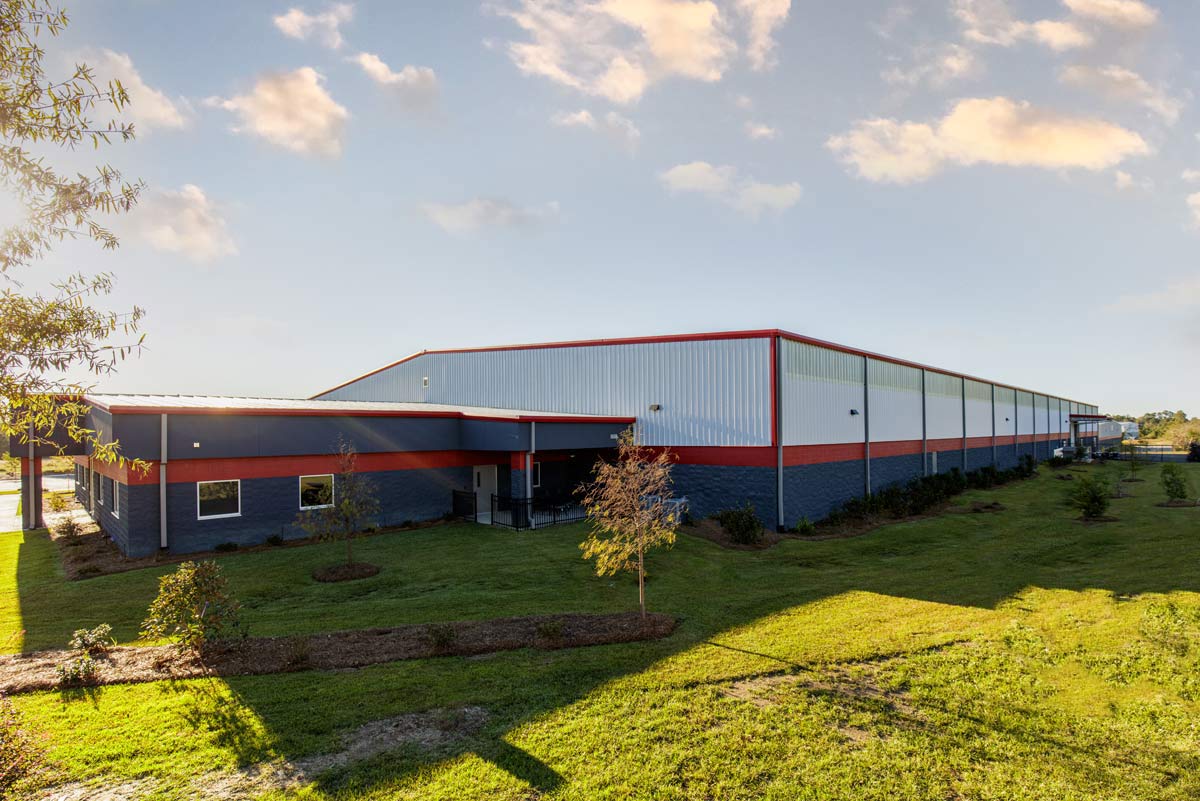 This 65,520 sq ft warehouse and assembly facility uses a clear span framing system, Galvalume Ultra-Dek Roof and 24-gauge Kynar PBR Walls.